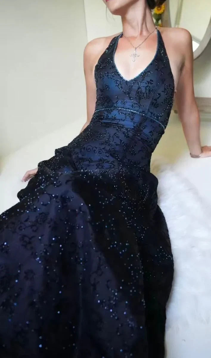 Sleeveless purple mermaid prom dress showing hourglass fit and flared lace hem